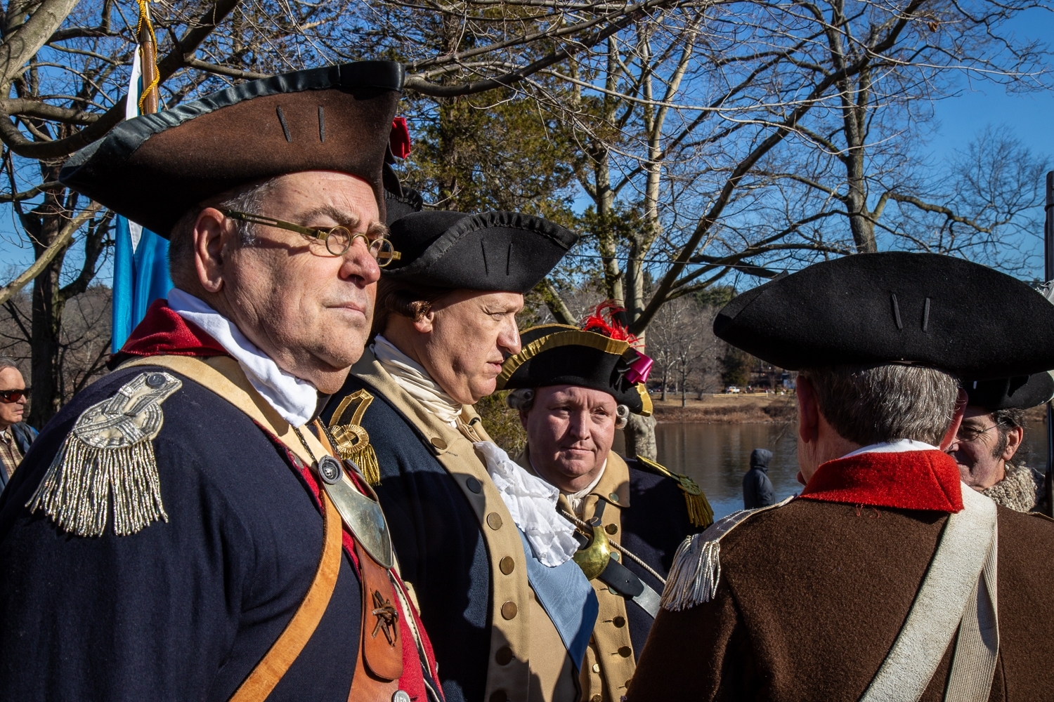 Washington Crossing, PA, USA - December 25, 2016: A renenactor portraying General George Washington speaks with other reenactors before crossing the Delaware River.