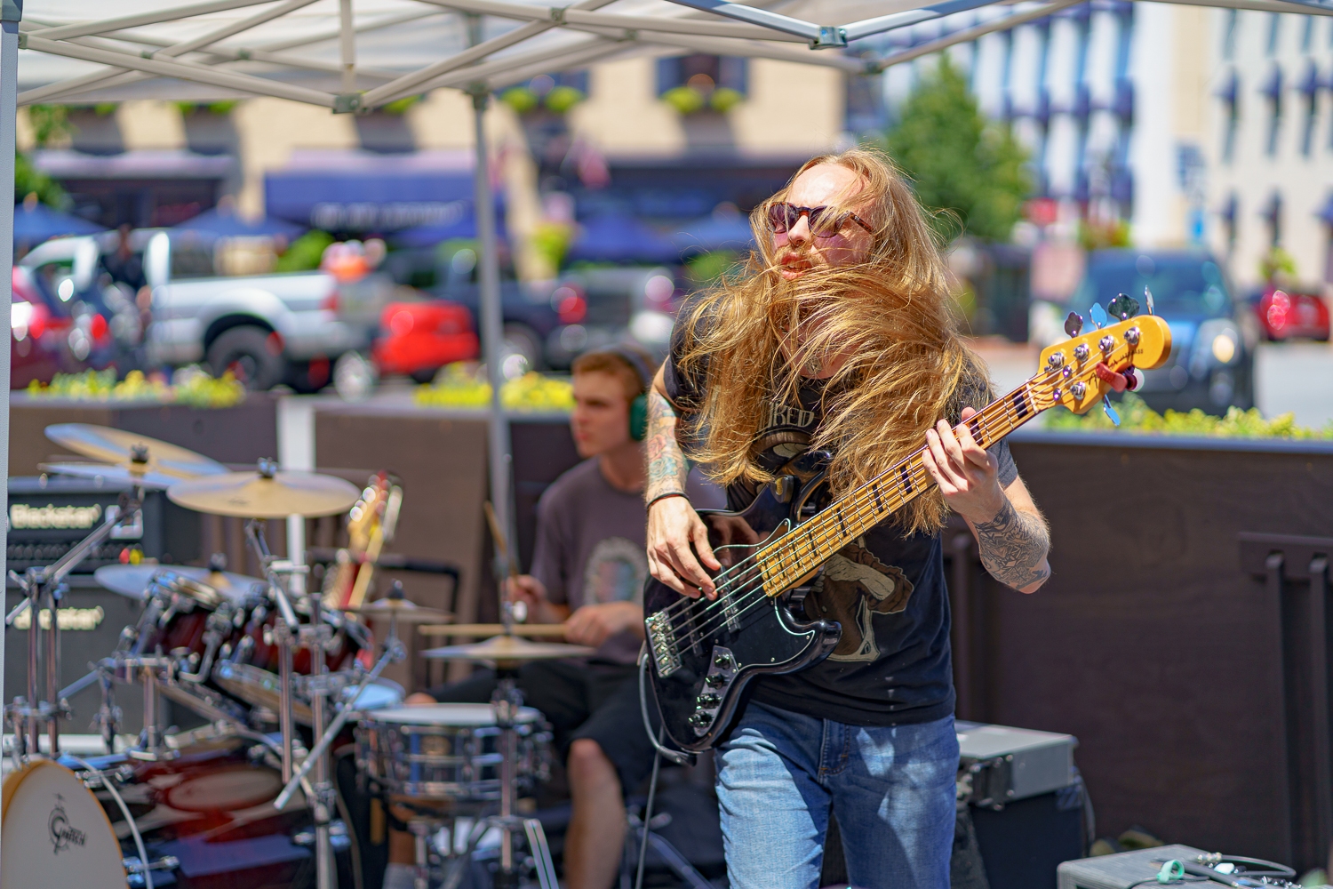 Gettysburg, PA, USA – July 3, 2022: A local band rocks the downtown square over the July 4th celebration with loud music and wild hair to the delight of Adams County, PA.