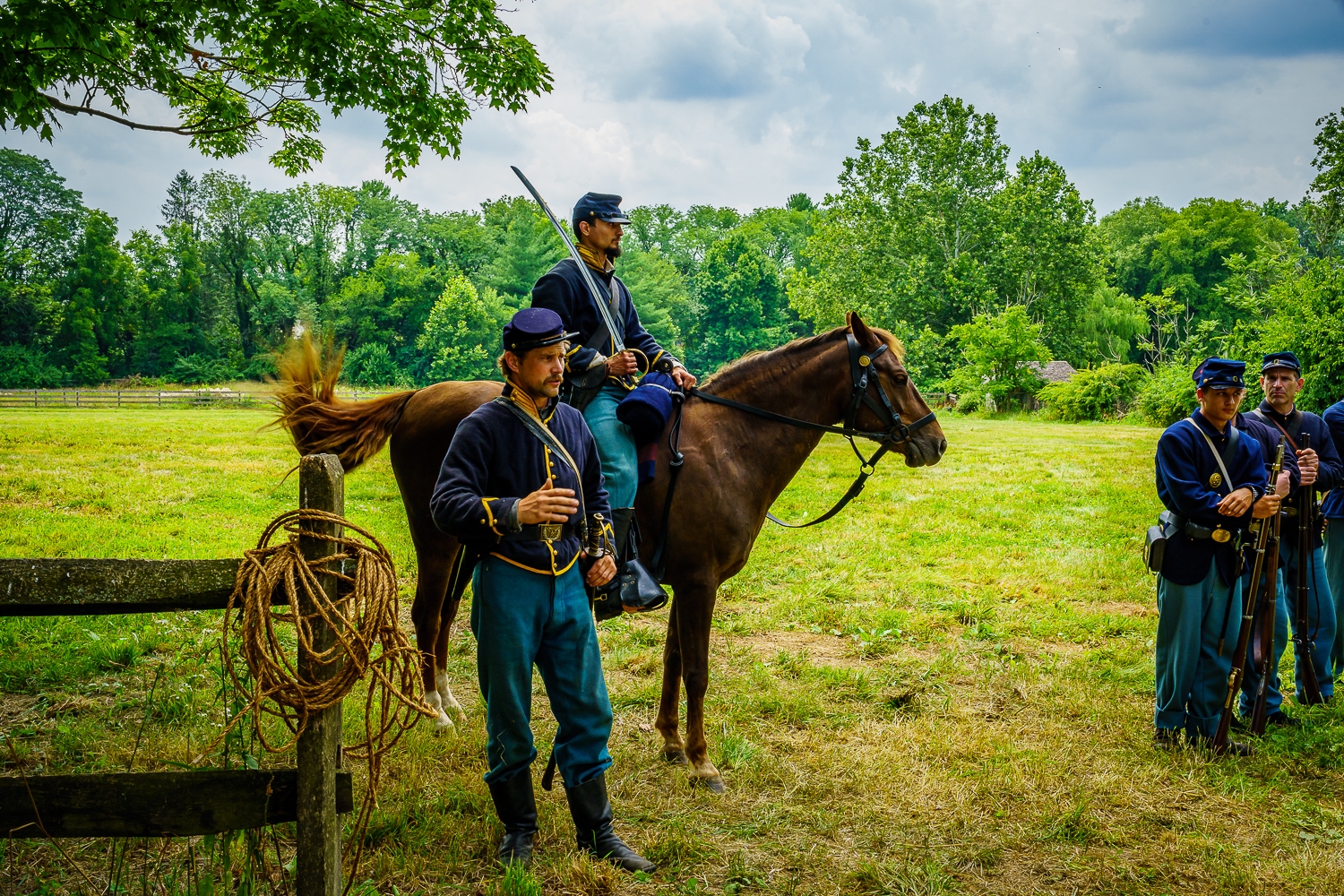 Lancaster, PA, USA – July 16, 2022: Union Army’s Cavalry Soldiers explain their duties and tactics to visitors at the Landis Valley Farm Museum during the Civil War Weekend Event.
