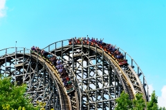 Hershey, PA, USA – June 27, 2021: Visitors at Hersheypark ride the first racing and dueling double-track wooden roller coaster in the United States.