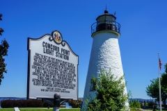 Havre de Grace, MD, USA – August 13, 2022: A historic marker sign at the Concord Point Lighthouse at the edge of the Chesapeake Bay shore.