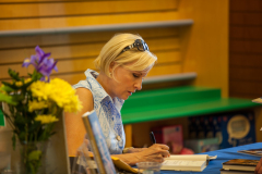 Mika Brzezinski signs her book.