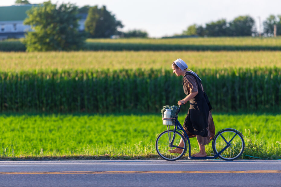 Amish woman on bike scooter.